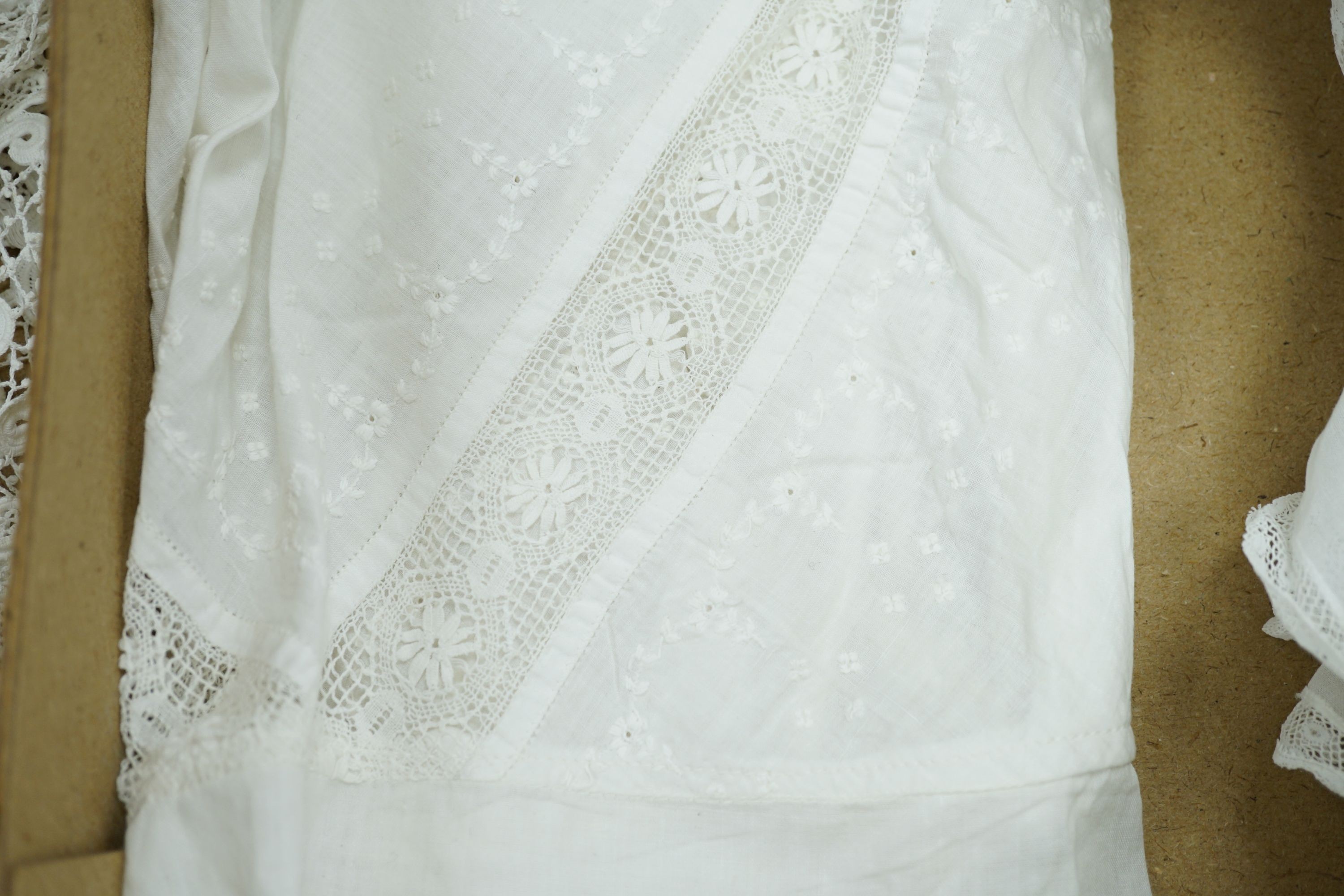 A 19th century hand made Irish crochet jacket, with long sleeves and high collar, a bobbin lace and white worked patch worked blouse, a fine lawn and anglaise worked blouse and a fine bobbin lace trimmed and white worked